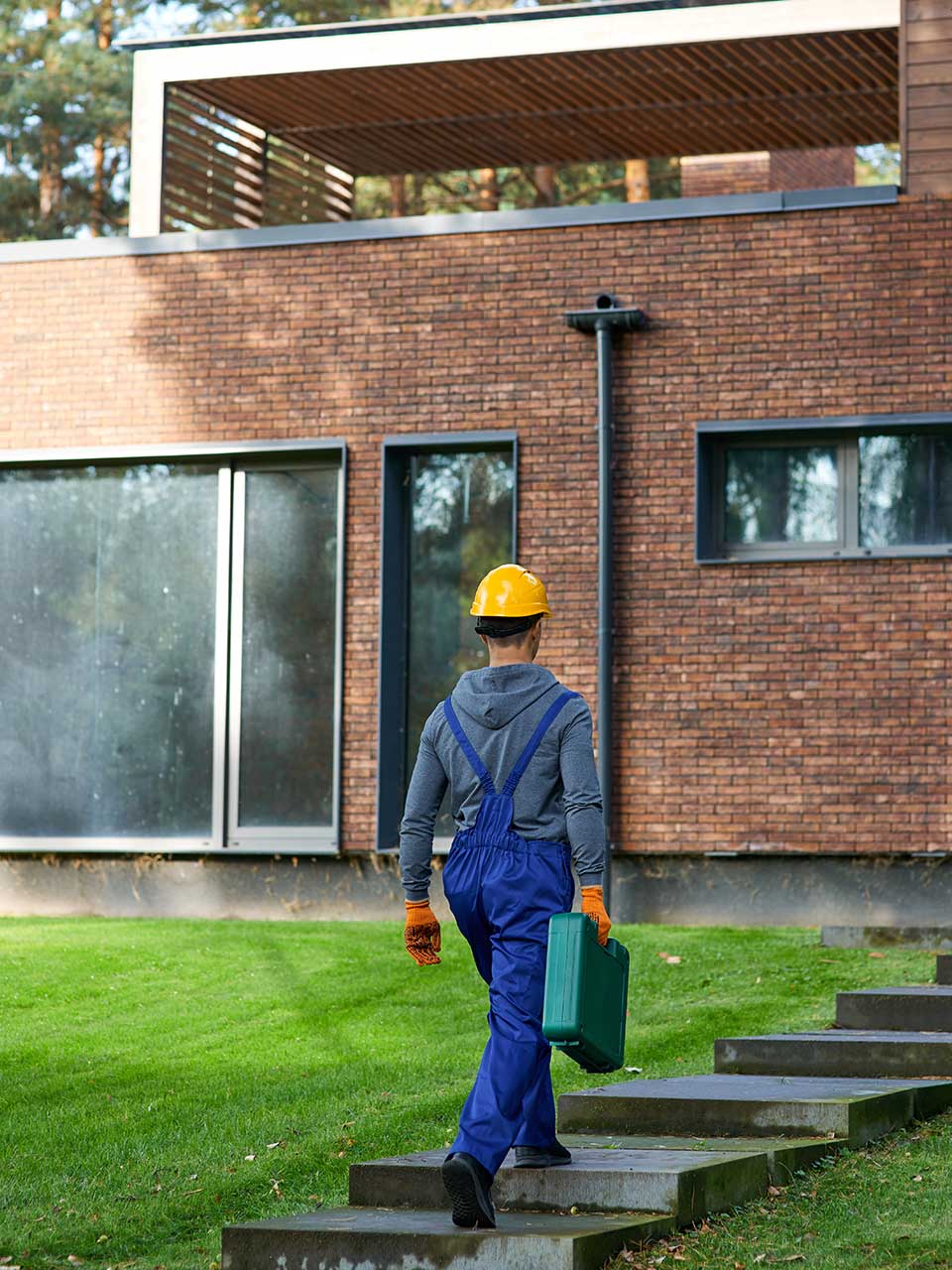 Worker walking toward home project site
