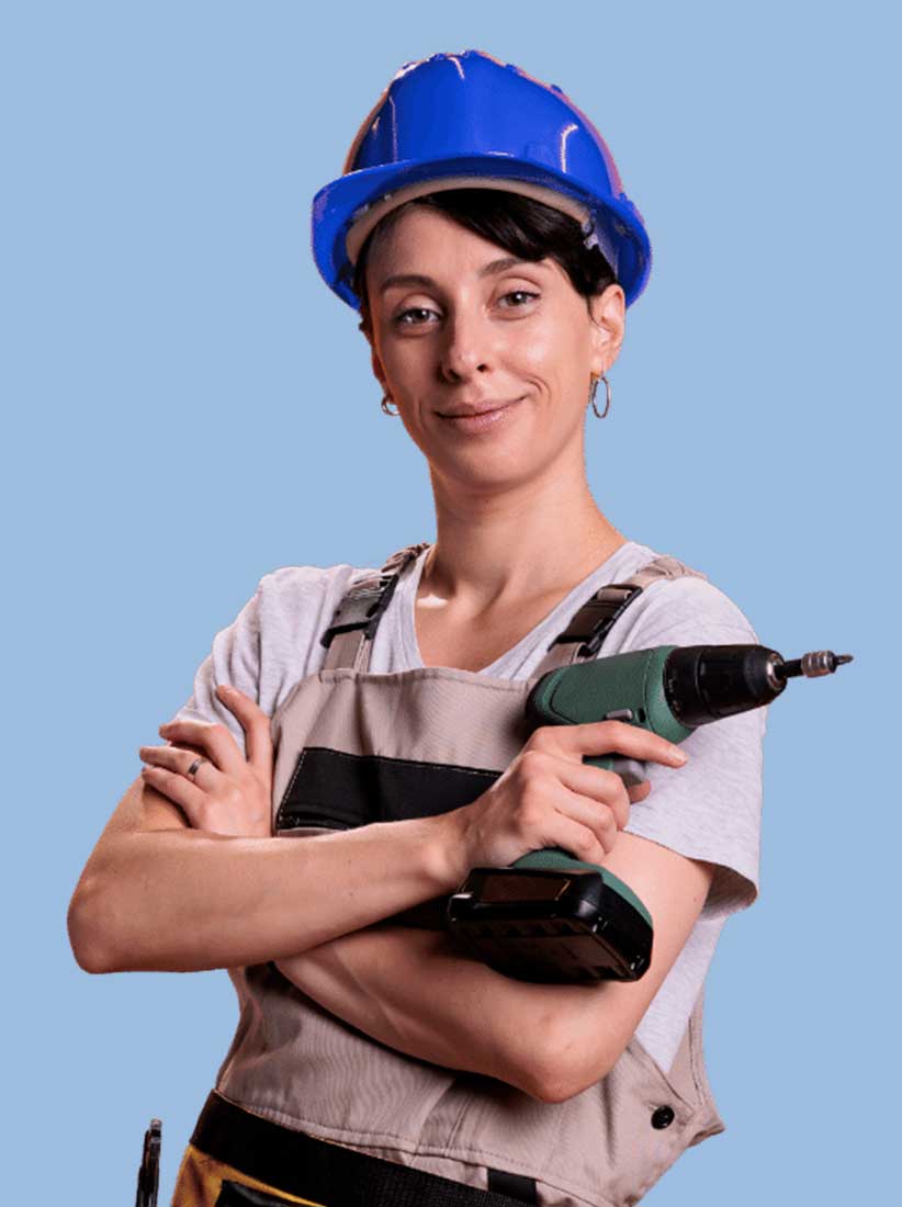 Young technician holding a drill