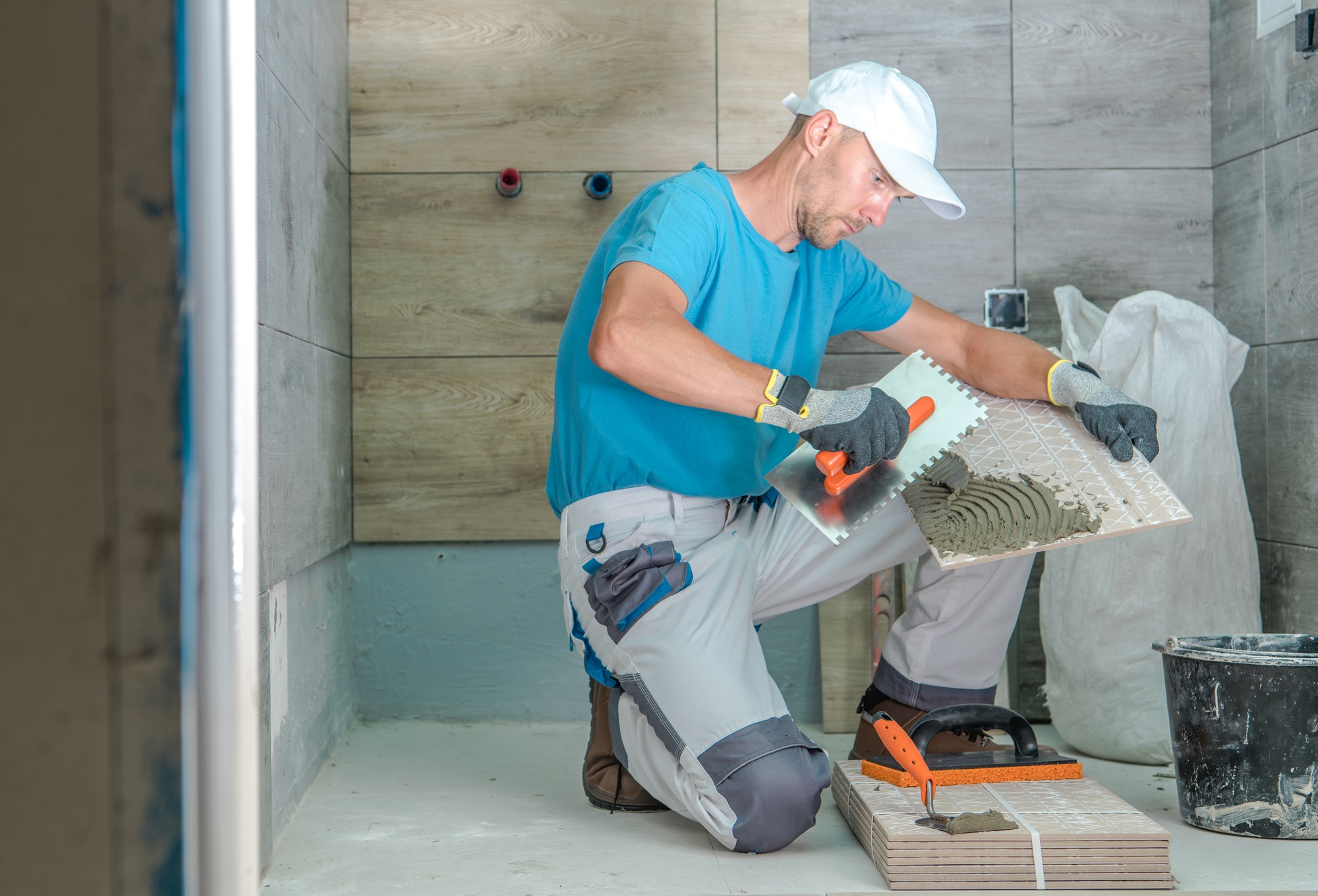 Installing tile for bathroom remodeling in Kansas City